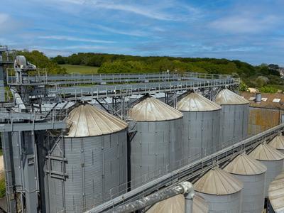 Aerial view of steel grain silos at a storage facility on the Isle of Wight